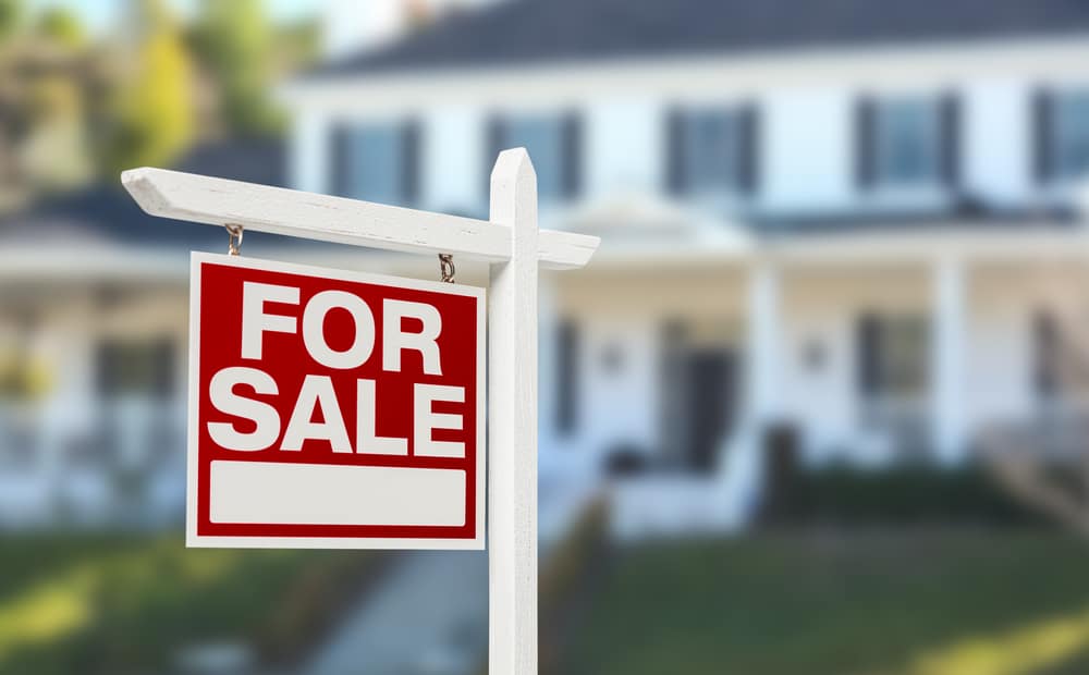 Home,For,Sale,Real,Estate,Sign,In,Front,Of,Beautiful house for sale